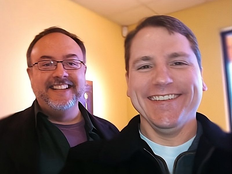 Eric Huber and Collin Condray at their first virtual office at Panera in Fayetteville, Arkansas